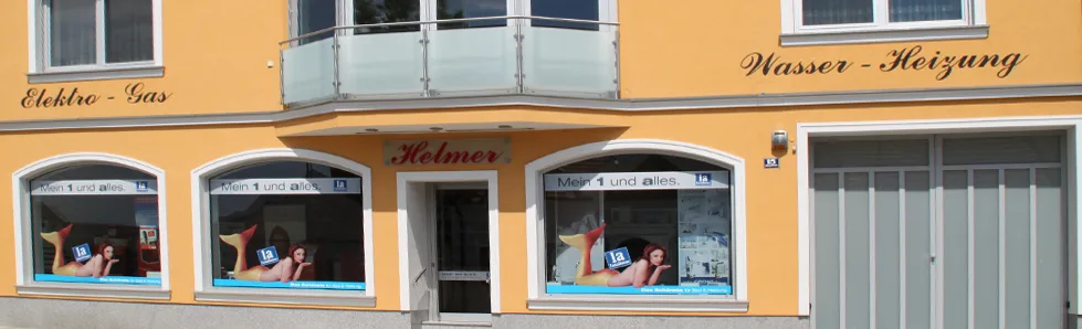 Fassade der Franz Helmer GmbH in Bockfließ mit den Schriftzügen Elektro, Gas, Wasser und Heizung